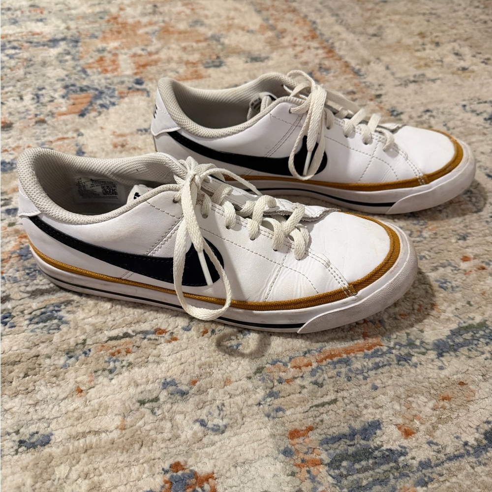 Nike White and Black Womens Sneakers with Gold Accents